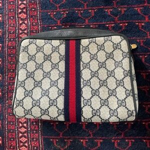 Dark navy Gucci clutch cosmetic blue red blue ribbon